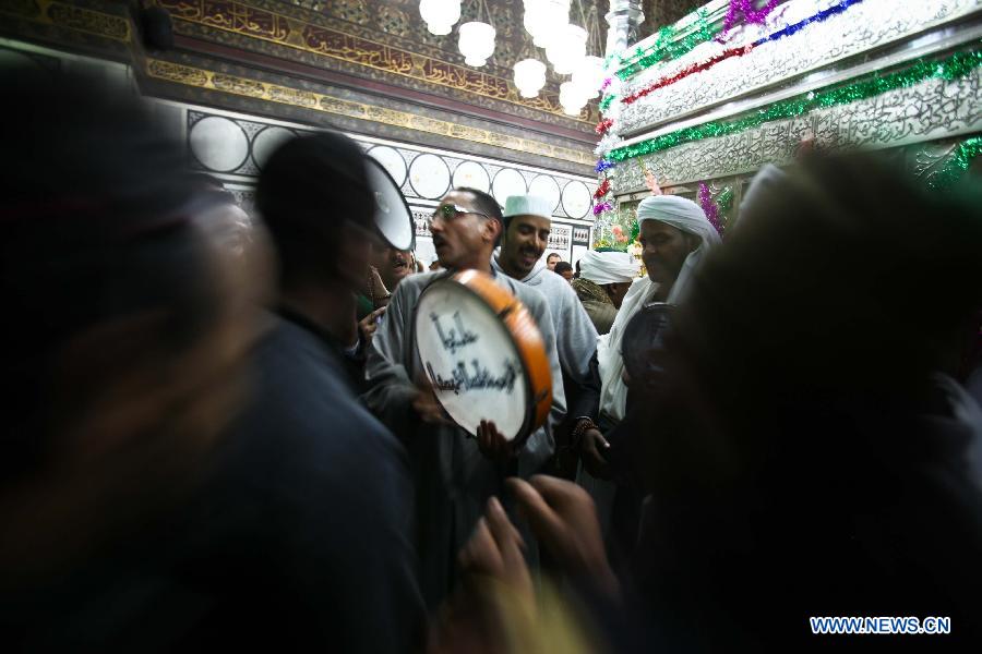 Sufi Muslims take part in sufi celebration rituals to celebrate the birth of Prophet Mohammed, at Al-Hussein mosque in Cairo, Egypt, Jan. 24, 2013. Hundreds of millions of Muslims celebrated the anniversary of Prophet Muhammad's birth all over the world. (Xinhua/Amru Salahuddien)