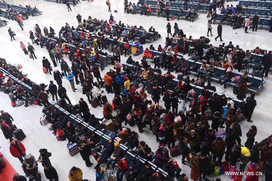 Passengers wait for trains at the Changchun Railway Station in Changchun, capital of northeast China's Jilin Province, Jan. 26, 2013. The 40-day Spring Festival travel rush started on Saturday. The Spring Festival, which falls on Feb. 10 this year, is traditionally the most important holiday of the Chinese people. It is a custom for families to reunite in the holiday, a factor that has led to massive seasonal travel rushes in recent years as more Chinese leave their hometowns to seek work elsewhere. Public transportation is expected to accommodate about 3.41 billion travelers nationwide during the holiday, including 225 million railway passengers, (Xinhua/Lin Hong) 