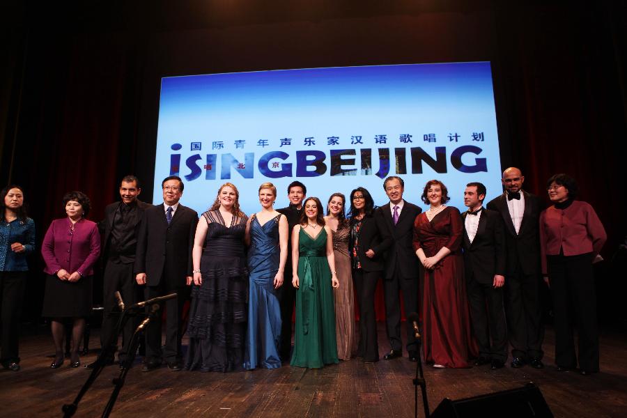 Chinese Vice Minister of Education Hao Ping (4th L) and Chinese Ambassador to France Kong Quan (5th R) pose with members of the "I Sing Beijing" Chinese songs performance team during the closing ceremony of the Chinese Language Year in Paris, capital of France, on Jan. 24, 2013. The cross language year program, which included the Chinese Language Year in France followed by the French Language Year in China, was initiated by Chinese President Hu Jintao and former French President Nicolas Sarkozy in November 2010. (Xinhua/Gao Jing)