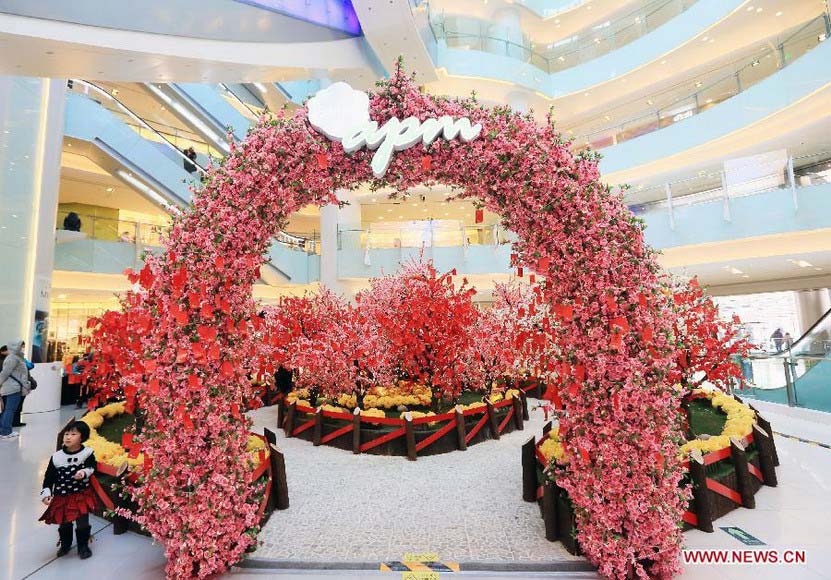 Cards with people's New Year wishes written on them are tied to wishing trees at a shopping mall in Wangfujing, a commercial area in Beijing, capital of China, Jan. 26, 2013. (Xinhua/Luo Wei)