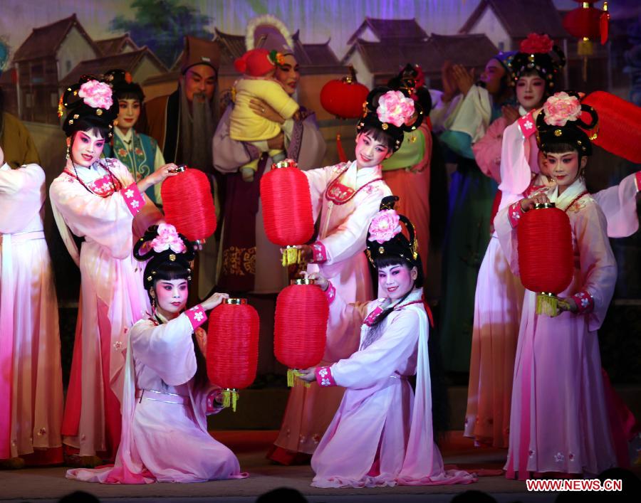 Actresses perform Puxian opera, one of the oldest forms of Chinese opera, at the Dongqin Village in Putian City, southeast China's Fujian Province, Jan. 26, 2013. Puxian opera, which originated from puppet shows, has been listed as a national intangible cultural heritage. (Xinhua/Lin Jianbing)