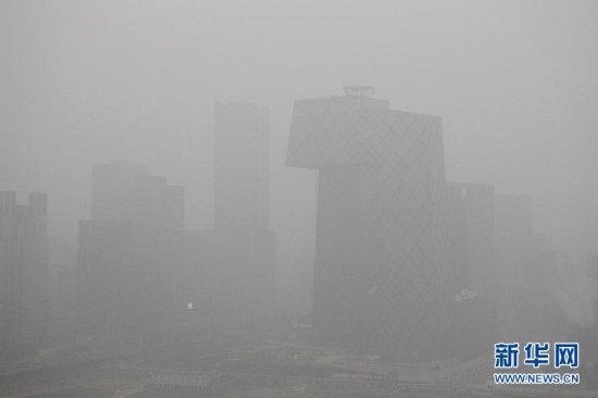 Skyscrapers in the Beijing Central Business District are enveloped by fog, Jan. 13. Beijing's meteorological center on Monday issued a yellow-coded alert for haze as the fourth foggy weather in this month hit the city and cuts the visibility below 3,000 meters in major parts of Beijing. (Photo/Xinhua)