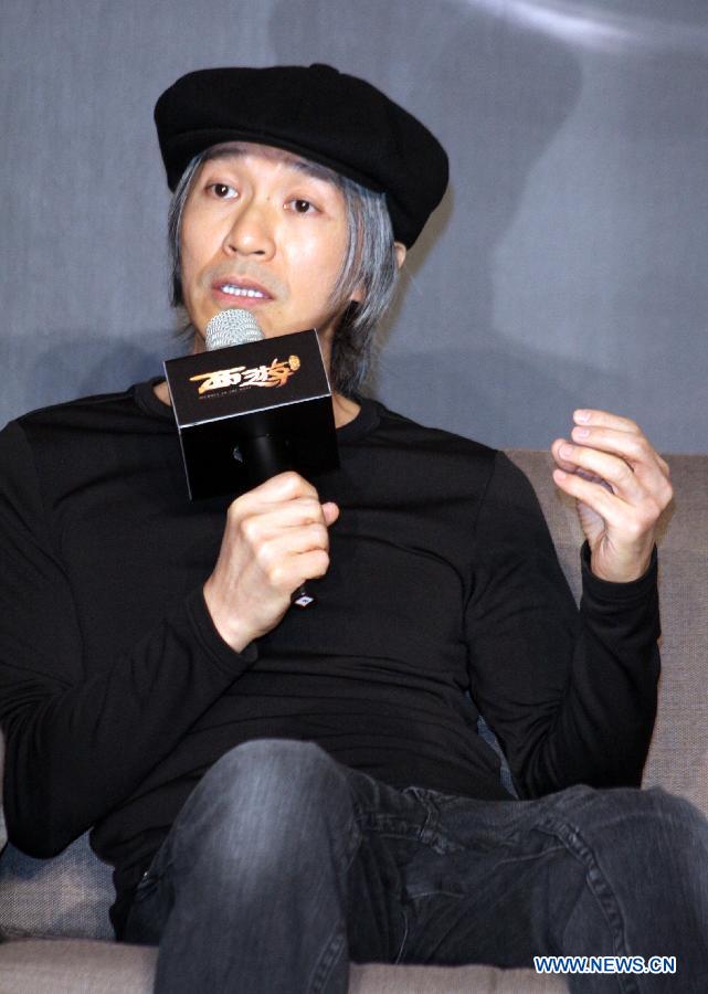 Director Stephen Chow receives interview during a press conference of the movie "Journey to the West: Conquering the Demons" in Taipei, southeast China's Taiwan, Jan. 28, 2013. The movie is expected to hit the screen on Feb. 7, 2013 in Taipei. (Xinhua)