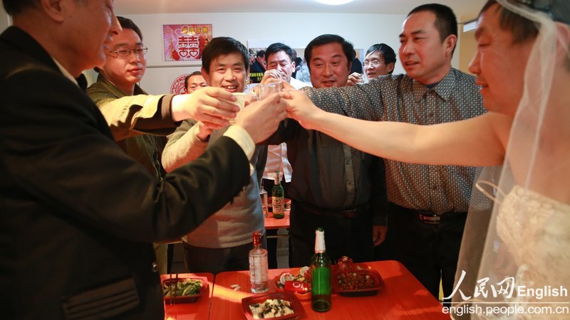 With the witness of several supporters, a special wedding ceremony for two old men is held in Pinggu district of Beijing, Jan. 30. Recently, a pair of old men, a retired teacher and a bottled water deliveryman, announced their engagement and became a hotly debated topic in China. (Photo/CFP)