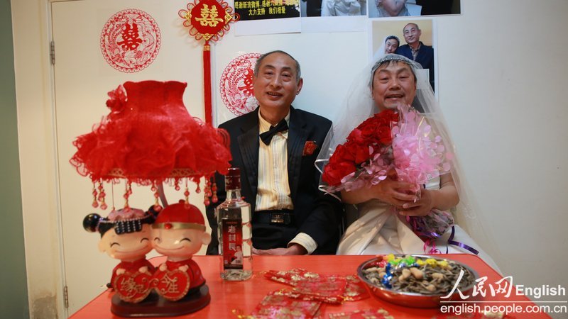 With the witness of several supporters, a special wedding ceremony for two old men is held in Pinggu district of Beijing, Jan. 30. Recently, a pair of old men, a retired teacher and a bottled water deliveryman, announced their engagement and became a hotly debated topic in China. (Photo/CFP)