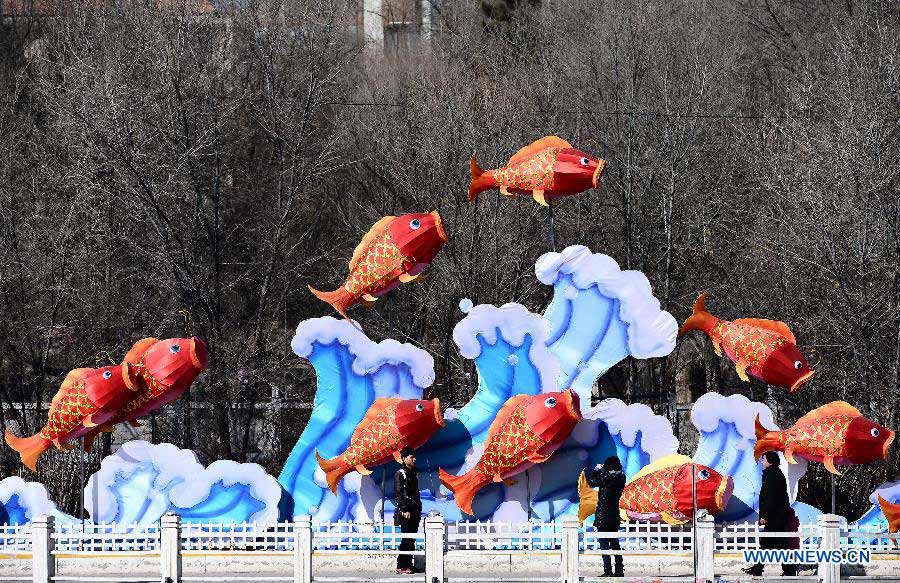 Citizens walk past lanterns on a street in Xining, capital of northwest China's Qinghai Province, Jan. 31, 2013. Various lanterns are used here to decorate the city for the upcoming China's Lunar New Year. (Xinhua/Zhang Hongxiang)