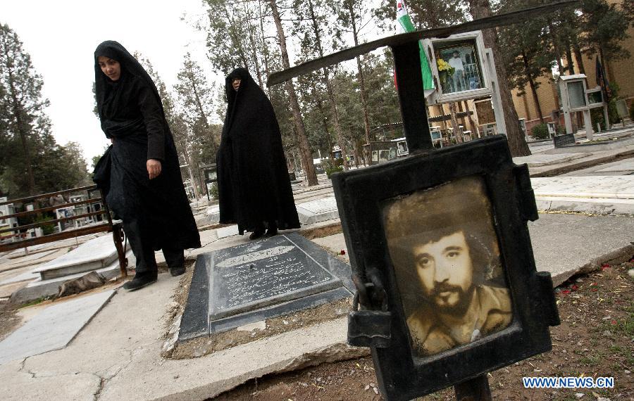 Iranian women visit the graves of people who were killed during the 1979 Islamic revolution at the Behesht-e Zahra cemetery outside Tehran, Iran, on Jan. 31, 2013, to mark the 34th anniversary of the Islamic revolution. (Xinhua/Ahmad Halabisaz) 