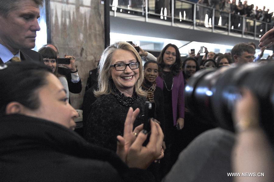 Outgoing U.S. Secretary of State Hillary Clinton poses for photos with State Department employees in Washington D.C. on Feb. 1, 2013. Clinton, replaced by John Kerry as the next secretary of state, bid a final farewell to her staff Friday. (Xinhua/Wang Yiou)