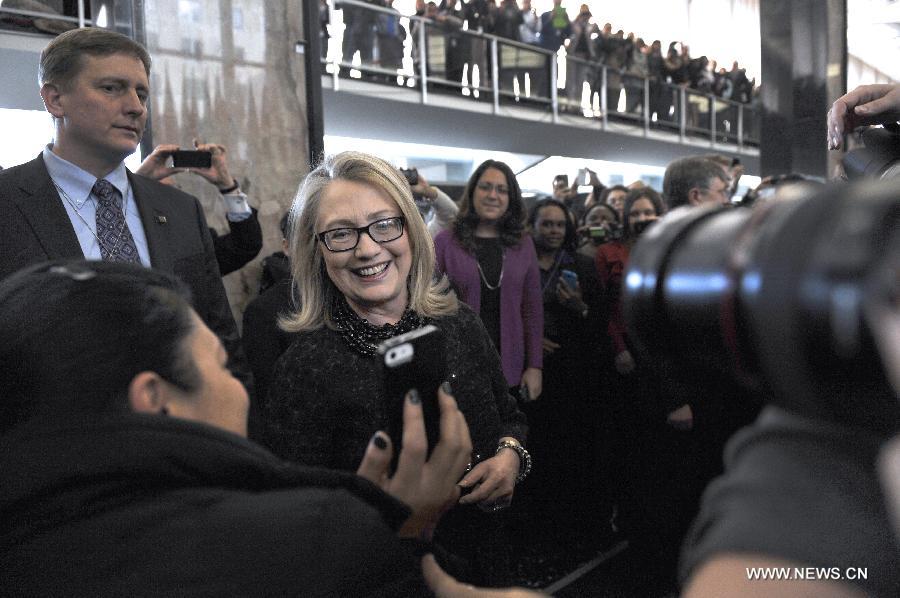 Outgoing U.S. Secretary of State Hillary Clinton poses for photos with State Department employees in Washington D.C. on Feb. 1, 2013. Clinton, replaced by John Kerry as the next secretary of state, bid a final farewell to her staff Friday. (Xinhua/Wang Yiou)