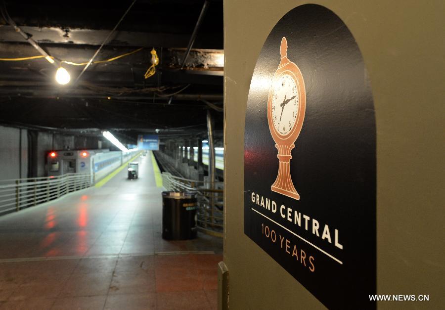 A poster marking the centennial celebrations of Grand Central Terminal is seen on the platform inside Grand Central Terminal in New York on Feb. 1, 2013. Grand Central Terminal, the New York city's landmark, turned 100 years old on Friday. (Xinhua/Wang Lei)