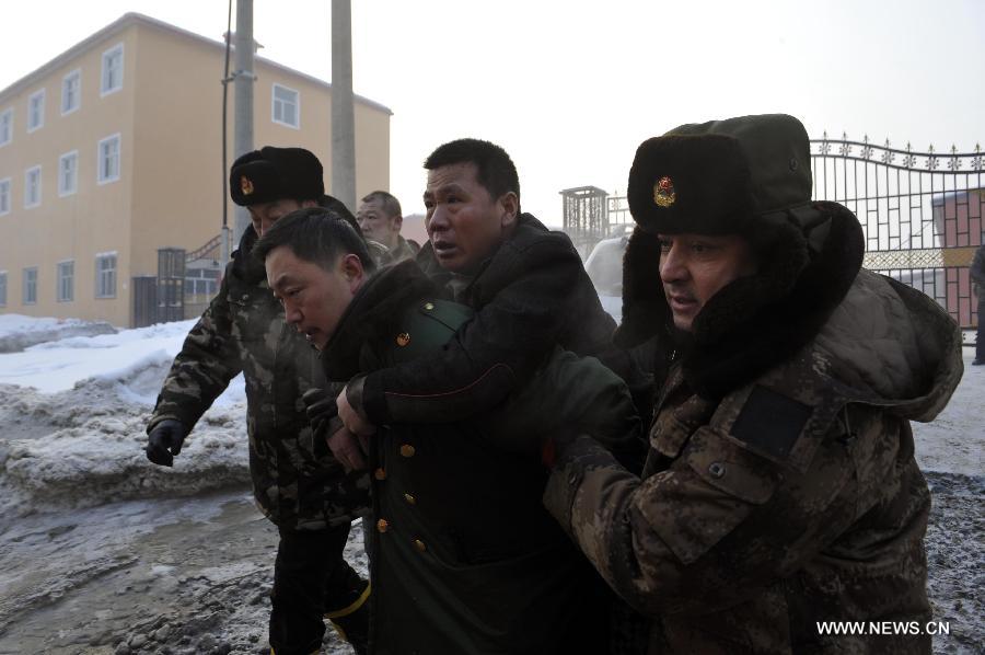 Rescuers transfer a trapped citizen of a dyke breaching accident of the Lianfeng Reservoir in Urumqi, capital of northwest China's Xinjiang Uygur Autonomous Region, Feb. 2, 2013. At least one person was killed after a dyke breaching occured at the reservior on the morning of Saturday. The rescue work is underway. (Xinhua/Zhao Ge) 