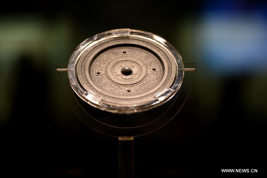 Photo taken on Feb. 2, 2013 shows a bronze mirror during an ancient bronze mirror exhibition in Hefei, capital of east China's Anhui Province. The exhibition, displaying a total of 153 bronze mirrors, opened here Saturday. (Xinhua/Zhang Duan)