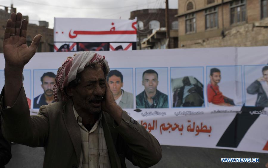 A protestor shouts slogans during a demonstration requiring the government to provide medical treatment to protestors who were wounded during the 2011 uprising in Sanaa, Yemen, on Feb. 3, 2013. (Xinhua/Mohammed Mohammed)