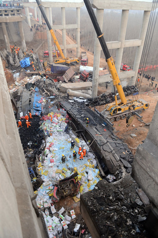 A photo taken on Feb. 1 shows the accident scene after a bridge partially collapsed due to a massive firework explosion in Sanmenxia city, central China’s Henan province, Feb. 1. Road accidents have claimed about 60 lives from Jan. 31 to Feb. 1. The fatal accidents shocked the whole country as hundreds of millions of Chinese journeyed home amid the Spring Festival travel rush that started on Jan. 26. (Photo/Xinhua)