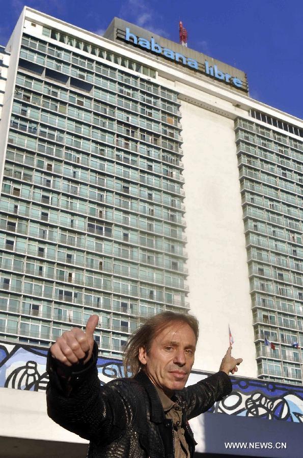 The so-called French Spiderman, Alain Robert, gets ready to scale the landmark Havana Libre hotel in Havana, Cuba, on Feb. 4, 2013. (Xinhua/Joaquin Hernandez) 