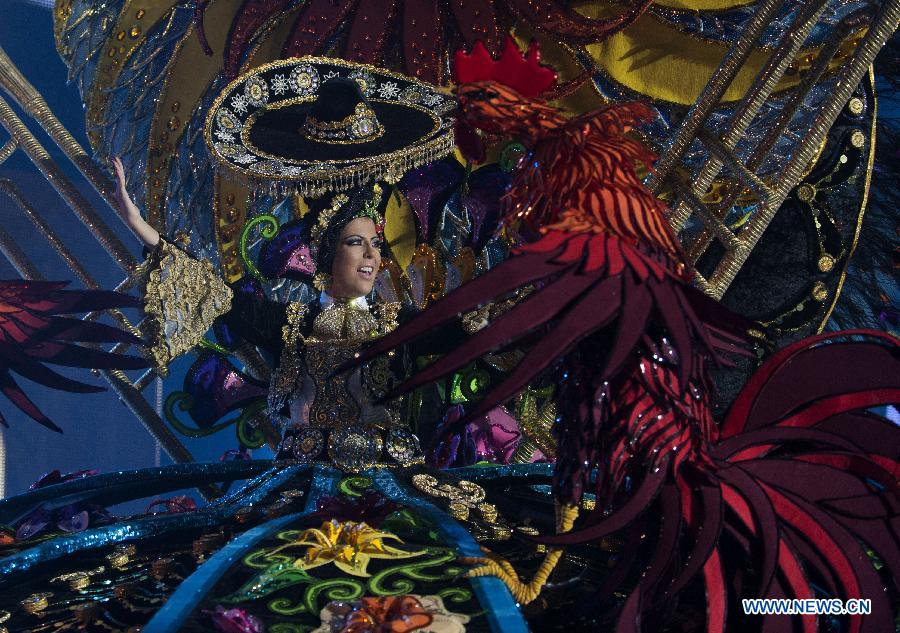 A contestant performs during the Carnival Queen pageant in Santa Cruz, Spain, Feb. 6, 2013. (Xinhua/Xie Haining)