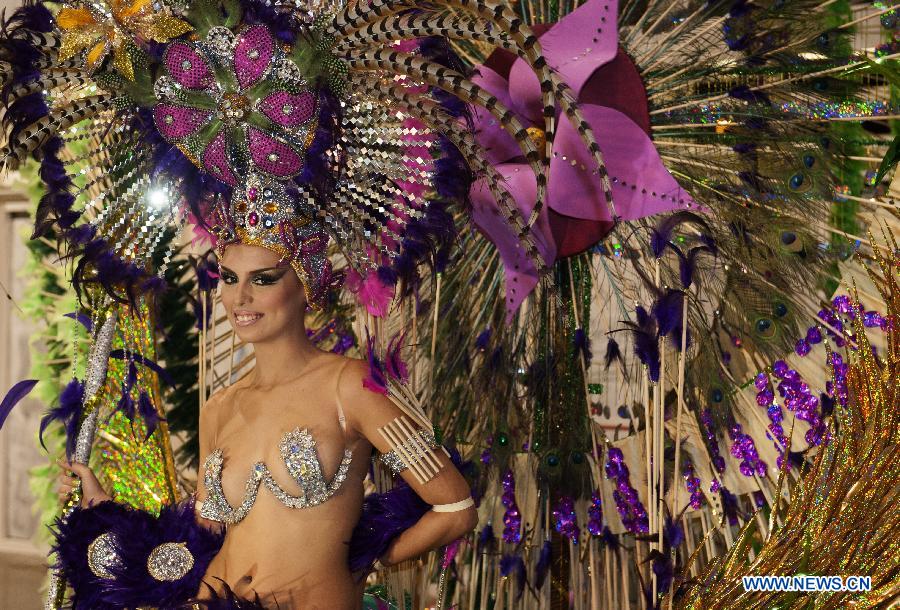 A contestant performs during the Carnival Queen pageant in Santa Cruz, Spain, Feb. 6, 2013. (Xinhua/Xie Haining)