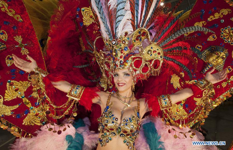 A contestant performs during the Carnival Queen pageant in Santa Cruz, Spain, Feb. 6, 2013. (Xinhua/Xie Haining)