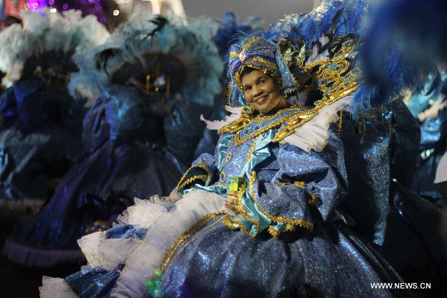 A reveller takes part in the carnival celebration, at the Sambadrome, in Sao Paulo, Brazil, on Feb. 9, 2013. (Xinhua/Rahel Patrasso) 