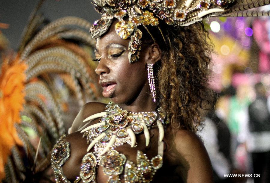 A dancer from the Nene da Vila Matilde Samba School perform during the carnival celebration, at the Sambadrome, in Sao Paulo, Brazil, on Feb. 9, 2013. (Xinhua/Rahel Patrasso)