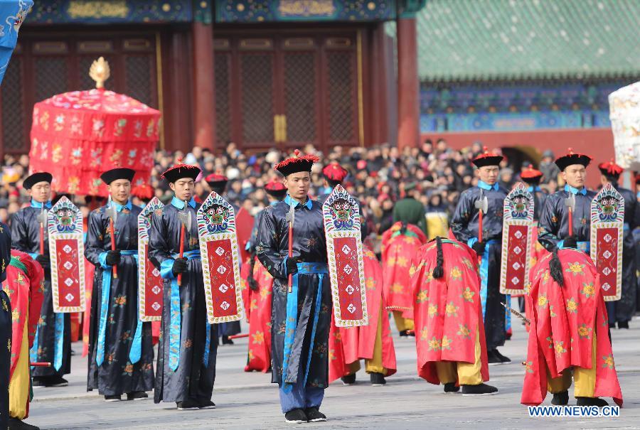 Performers wearing costumes of the Qing Dynasty (1644-1911) act during a performance presenting the ancient royal heaven worship ceremony in the Temple of Heaven in Beijing, capital of China, Feb. 10, 2013. The Temple of Heaven, first built in 1420 and used to be the imperial sacrificial altar during the Ming (1368-1644) and Qing dynasties, held reenaction of the ancient royal ritual for the worship of the heaven on Sunday, the first day of Chinese Lunar New Year. The performance will also be given in the next four days. (Xinhua/Liang Zhiqiang)  