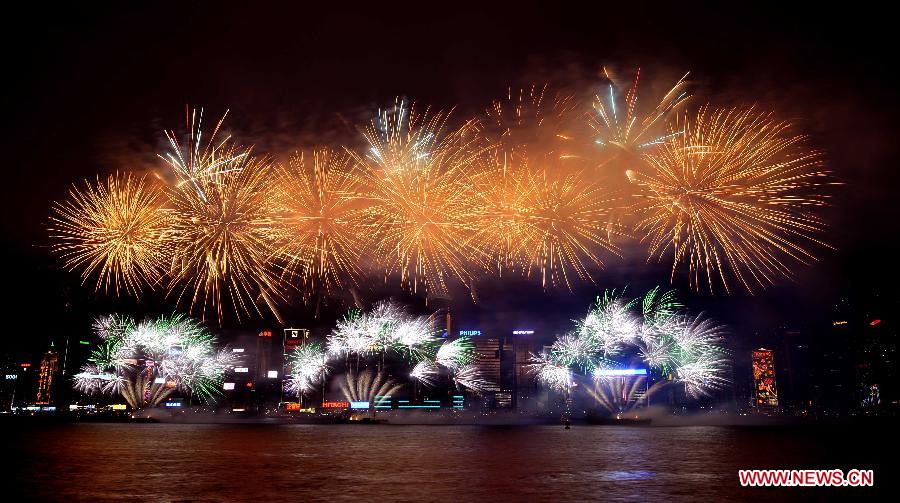 Fireworks light up the Victoria Harbor during the Chinese lunar New Year celebrations in Hong Kong, south China, Feb. 11, 2013. The Chinese lunar New Year this year, the year of snake, started on Feb. 10. (Xinhua/Chen Xiaowei) 