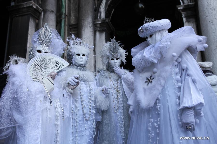 Costumed revellers participate in the carnival in Venice, Italy, on Feb. 10, 2013. The 18-day 2013 Venice carnival will end on Feb. 12. (Xinhua/Huang Xiaozhe) 