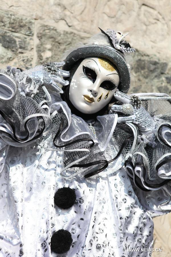 A costumed reveller participates in the carnival in Venice, Italy, on Feb. 10, 2013. The 18-day 2013 Venice carnival will end on Feb. 12. (Xinhua/Huang Xiaozhe) 