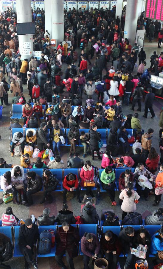 Passengers wait at a long-distance coach station in Renshou County, Meishan City, southwest China's Sichuan Province, Feb. 13, 2013. The number of road passengers rises as half of the week-long Spring Festival holiday has passed, and many people are returning to their jobs from home-reunions. (Xinhua/Yao Yongliang)