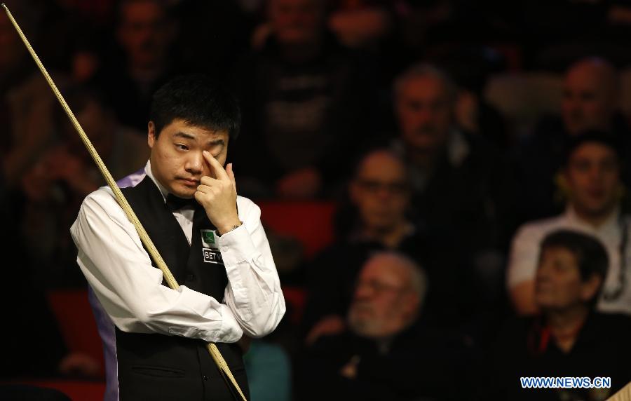 Ding Junhui of China reacts during Round of 32 in 2013 Welsh Snooker Open against Mark King of England at Newport Centre in Newport, south Wales, Britain on Feb. 13, 2013. Ding won 4-0. (Xinhua/Wang Lili) 
