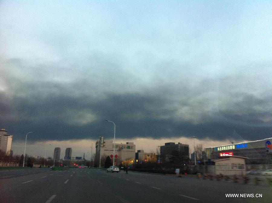 Smoke of the fire are seen in the sky above Xiqing District of north China's Tianjin Municipality, Feb. 15, 2013. An enterprise here caught fire on Friday. The cause and losses of the accident were not known immediately. (Xinhua/Yue Yuewei)  