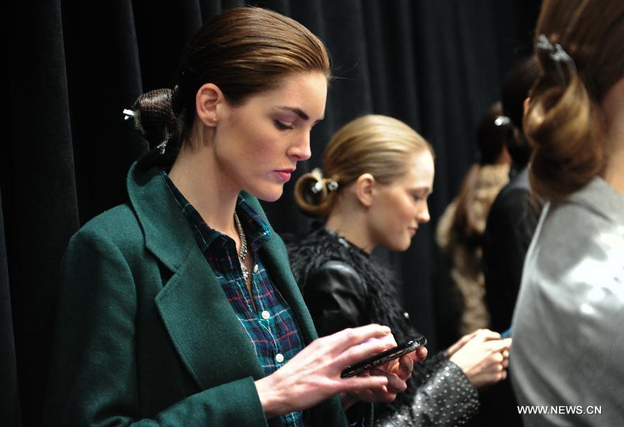 Models wait at the backstage before the presentation of Ralph Lauren 2013 Fall collections of the Mercedes-Benz Fashion Week in New York, Feb. 14, 2013. (Xinhua/Deng Jian)