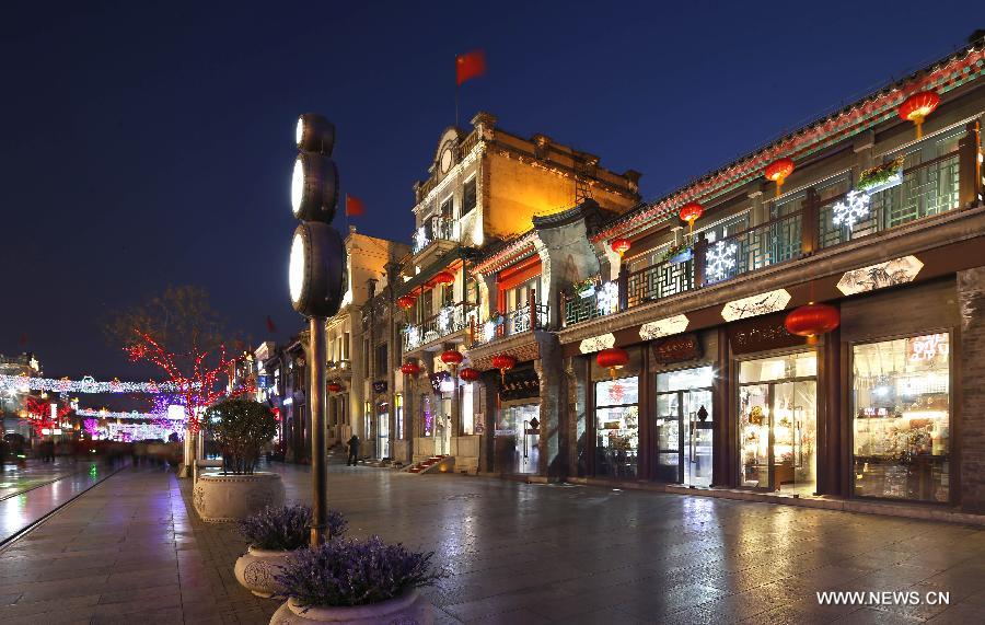 Photo taken on Feb. 15, 2013 shows the night scene of the Qianmen Street, a well-know commercial street, in downtown Beijing, capital of China. (Xinhua/Zhao Bing) 