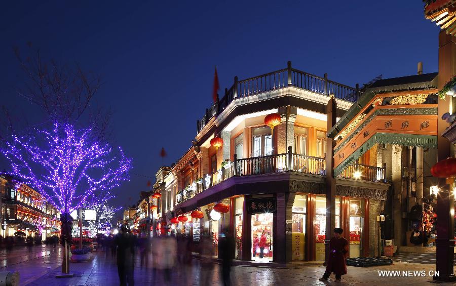 Photo taken on Feb. 15, 2013 shows the night scene of the Qianmen Street, a well-know commercial street, in downtown Beijing, capital of China. (Xinhua/Zhao Bing)  