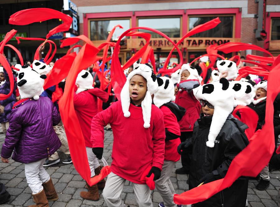 Children march during a parade to celebrate the traditonal Chinese Lunar New Year in Rockville, Maryland, the United States, Feb. 16, 2013. (Xinhua/Wang Yiou) 