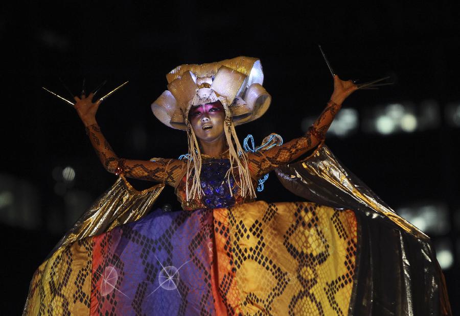 A performer in snake costume participates in a parade celebrating the Lunar New Year in Sydney, Australia, Feb. 17, 2013. (Xinhua/Jin Linpeng) 