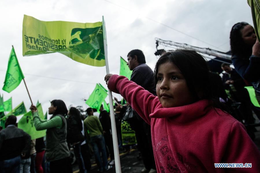 A girl attends a celebration for Ecuador's President Rafael Correa's virtual re-election, in Quito, capital of Ecuador, on Feb. 17, 2013. Ecuadorian President Rafael Correa was re-elected in Sunday's elections, according to preliminary results. (Xinhua/Jhon Paz) 