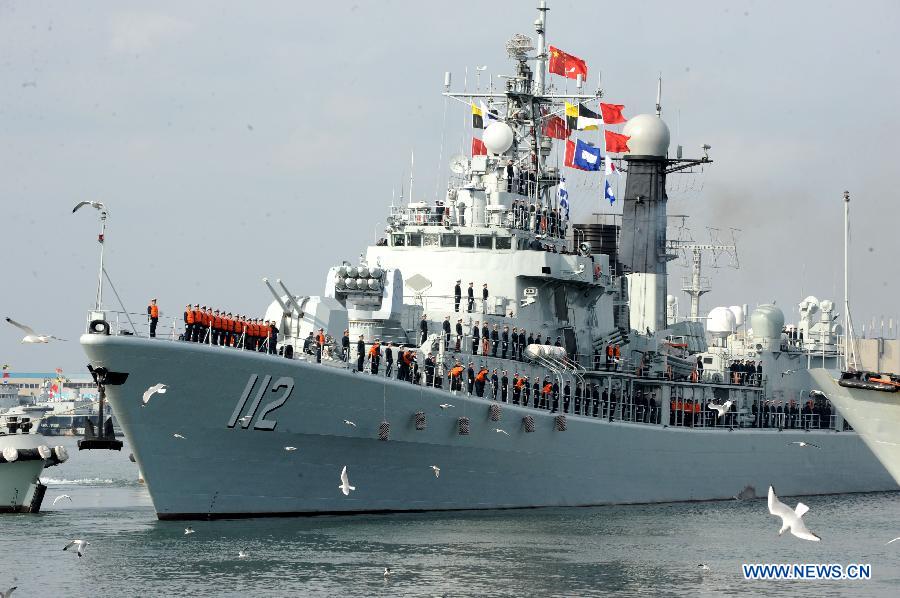 A missile destroyer "Harbin" sets sail at a port in Qingdao City, east China's Shandong Province, Feb. 16, 2013, to depart for the Gulf of Aden and the sea off Somalia on escort missions. The flotilla, as the 14th batch of its kind to engage in escort missions, consists of a missile destroyer and a frigate as well as a supply ship which are all from the North Sea Fleet of the People's Liberation Army (PLA) Navy. (Xinhua/Li Ziheng) 