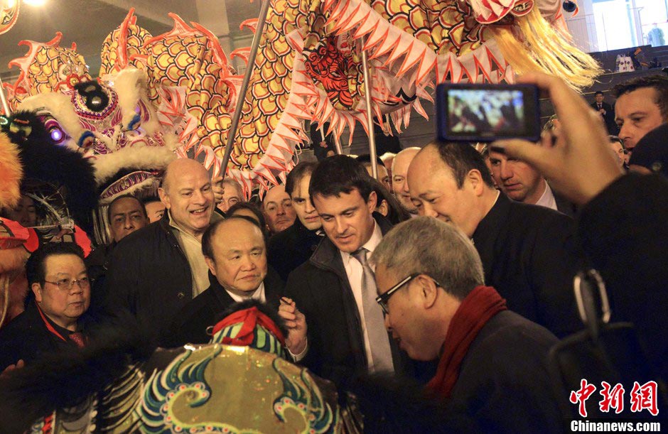 French officials join a parade to celebrate the traditional Chinese Lunar New Year in Paris, France, February 17, 2013. (CNS/Long Jianwu)