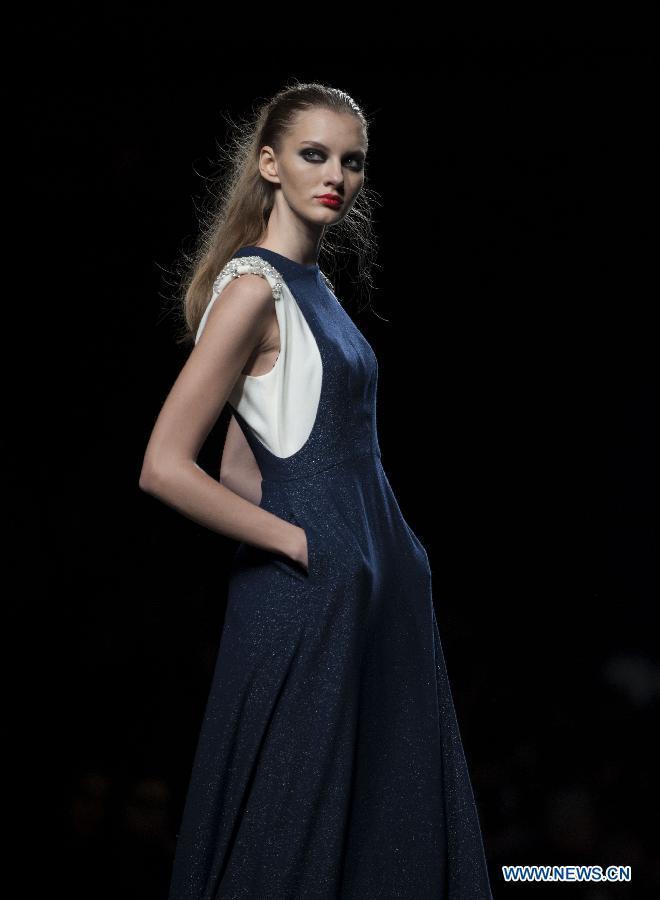 A model presents a creation by Teresa Helbig during Madrid Fashion Week in Madrid, Spain, on Feb. 18, 2013. (Xinhua/Xie Haining) 