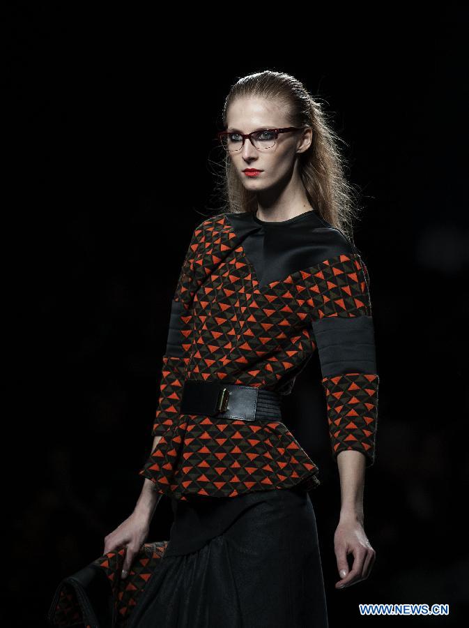 A model presents a creation by Teresa Helbig during Madrid Fashion Week in Madrid, Spain, on Feb. 18, 2013. (Xinhua/Xie Haining) 