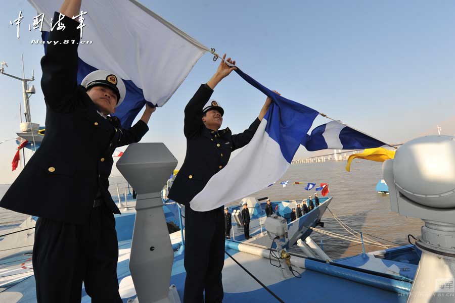 Officers and soldiers of a missile speedboat regiment under the South Sea Fleet of the Navy of the Chinese People's Liberation Army (PLA) created a festive atmosphere for their vessel by hanging flags, setting up show windows and writing couplets. (navy.81.cn/Shen Huayue)