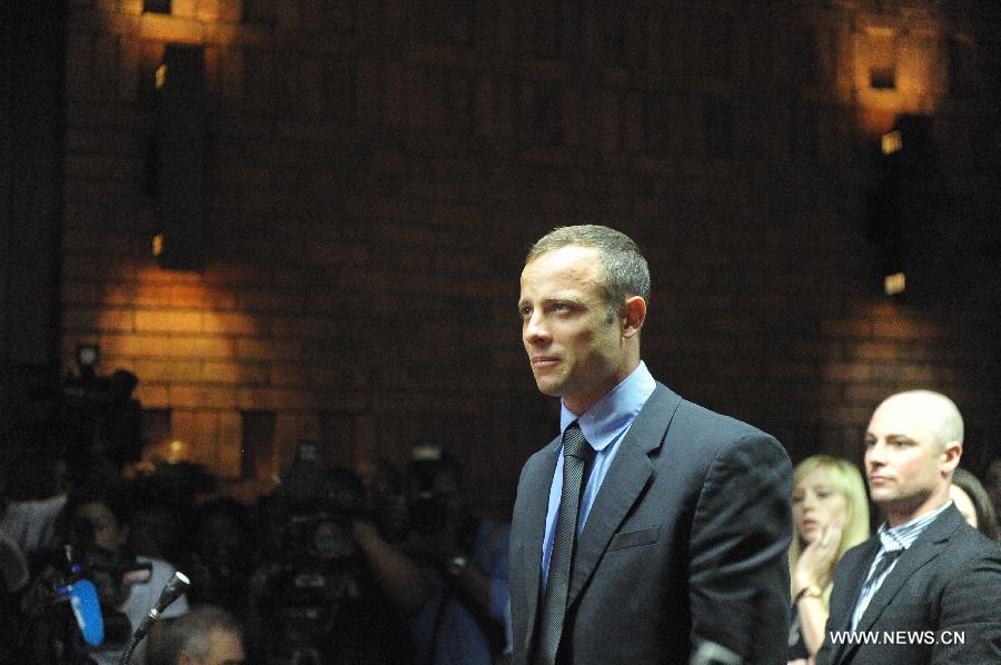 South African Olympic sprinter Oscar Pistorius appears at the Magistrate's Court to hear judgment on his bail application in Pretoria, South Africa, on Feb. 19, 2013. This was the second time that Pistorius appeared in court since he was arrested last Thursday for allegedly shooting model Reeva Steenkamp at his Pretoria home. (Xinhua/Li Qihua) 