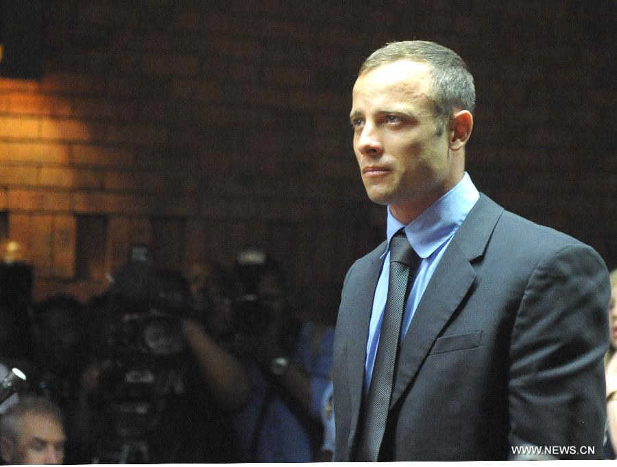 South African Olympic sprinter Oscar Pistorius appears at the Magistrate's Court to hear judgment on his bail application in Pretoria, South Africa, on Feb. 19, 2013. This was the second time that Pistorius appeared in court since he was arrested last Thursday for allegedly shooting model Reeva Steenkamp at his Pretoria home. (Xinhua/Li Qihua) 