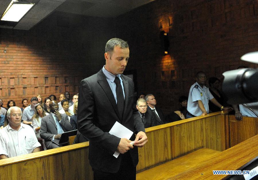 Paralympian Oscar Pistorius appears at the Pretoria Magistrate Court, South Africa, on Feb. 20, 2013. The bail hearing of murder-accused Pistorius resumed at the Pretoria Magistrate Court on Wednesday with a large media contingent scrambling to get inside. (Xinhua/Li Qihua) 