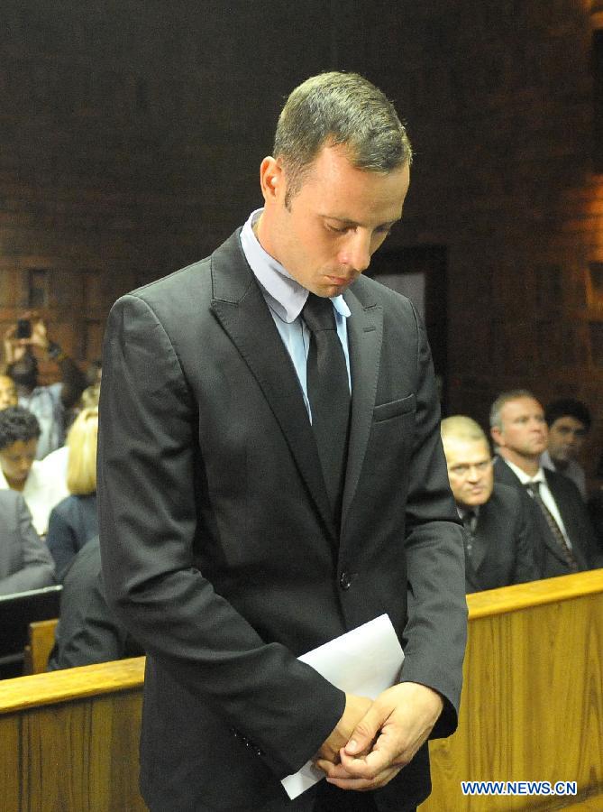 Paralympian Oscar Pistorius appears at the Pretoria Magistrate Court, South Africa, on Feb. 20, 2013. The bail hearing of murder-accused Pistorius resumed at the Pretoria Magistrate Court on Wednesday with a large media contingent scrambling to get inside. (Xinhua/Li Qihua) 