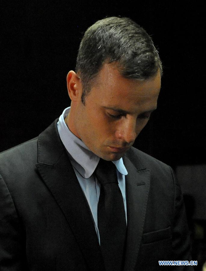 Paralympian Oscar Pistorius appears at the Pretoria Magistrate Court, South Africa, on Feb. 20, 2013. The bail hearing of murder-accused Pistorius resumed at the Pretoria Magistrate Court on Wednesday with a large media contingent scrambling to get inside. (Xinhua/Li Qihua) 