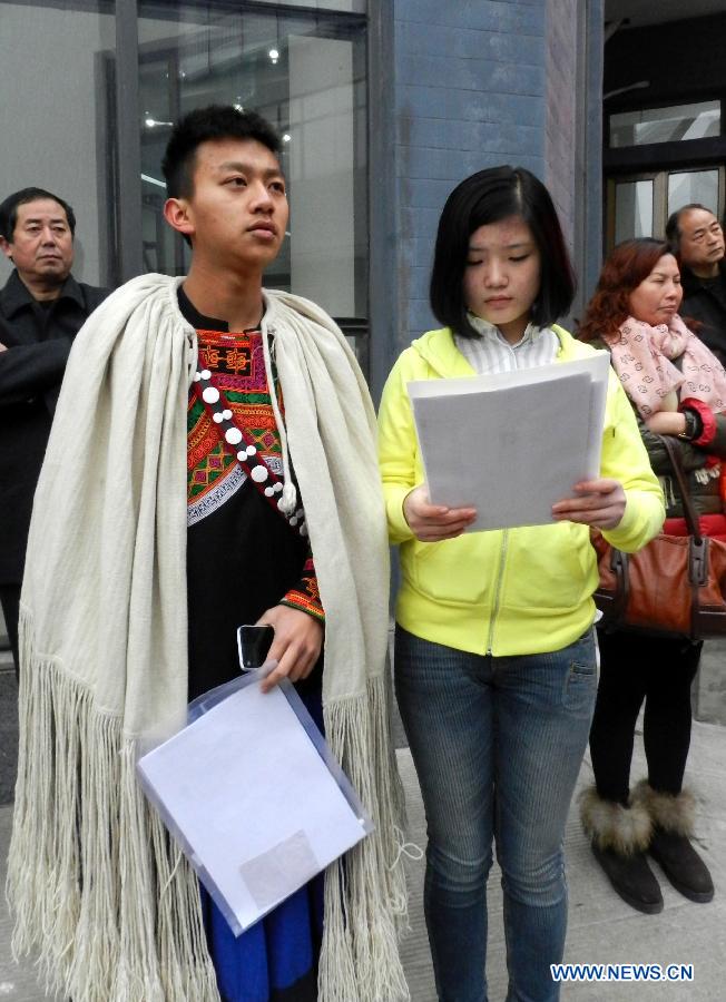 Examinees wait to sign up for the entrance examination of the Beijing Film Academy (BFA) in Beijing, capital of China, Feb. 21, 2013. BFA is one of China's leading bases of movie education, where many movie celebrities like director Zhang Yimou and numerous actors graduated. With the dreams to become future movie stars, thousands of young people cram to BFA for the enrollment exam every year. (Xinhua/Wang Zhen)