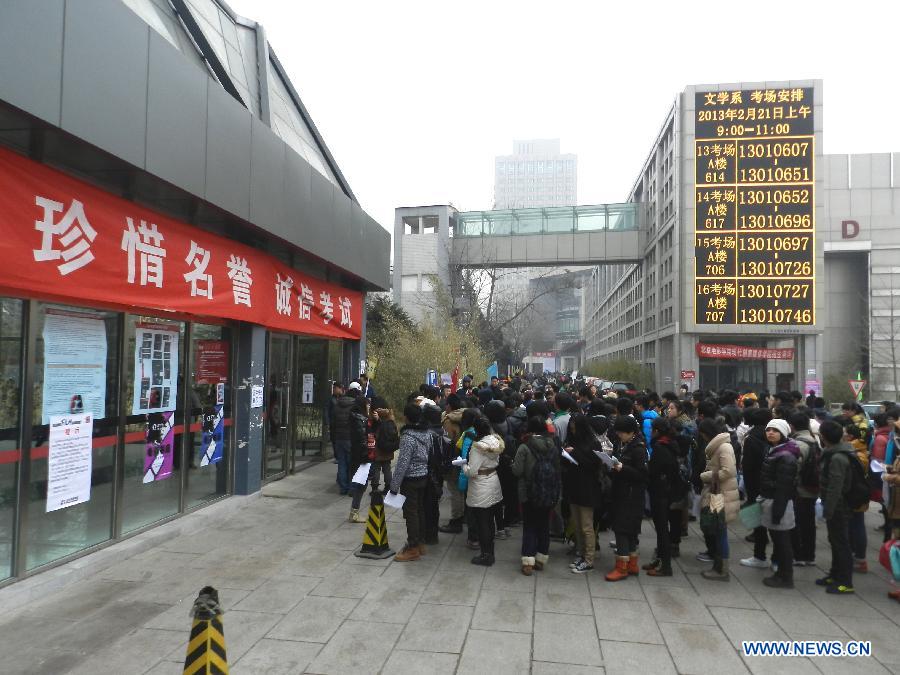 Examinees wait to sign up for the entrance examination of the Beijing Film Academy (BFA) in Beijing, capital of China, Feb. 21, 2013. BFA is one of China's leading bases of movie education, where many movie celebrities like director Zhang Yimou and numerous actors graduated. With the dreams to become future movie stars, thousands of young people cram to BFA for the enrollment exam every year. (Xinhua/Wang Zhen)