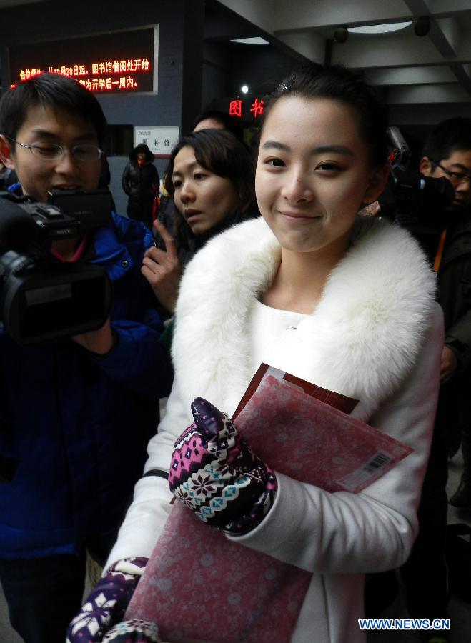 Examinees wait to sign up for the entrance examination of the Beijing Film Academy (BFA) in Beijing, capital of China, Feb. 21, 2013. BFA is one of China's leading bases of movie education, where many movie celebrities like director Zhang Yimou and numerous actors graduated. With the dreams to become future movie stars, thousands of young people cram to BFA for the enrollment exam every year. (Xinhua/Wang Zhen)